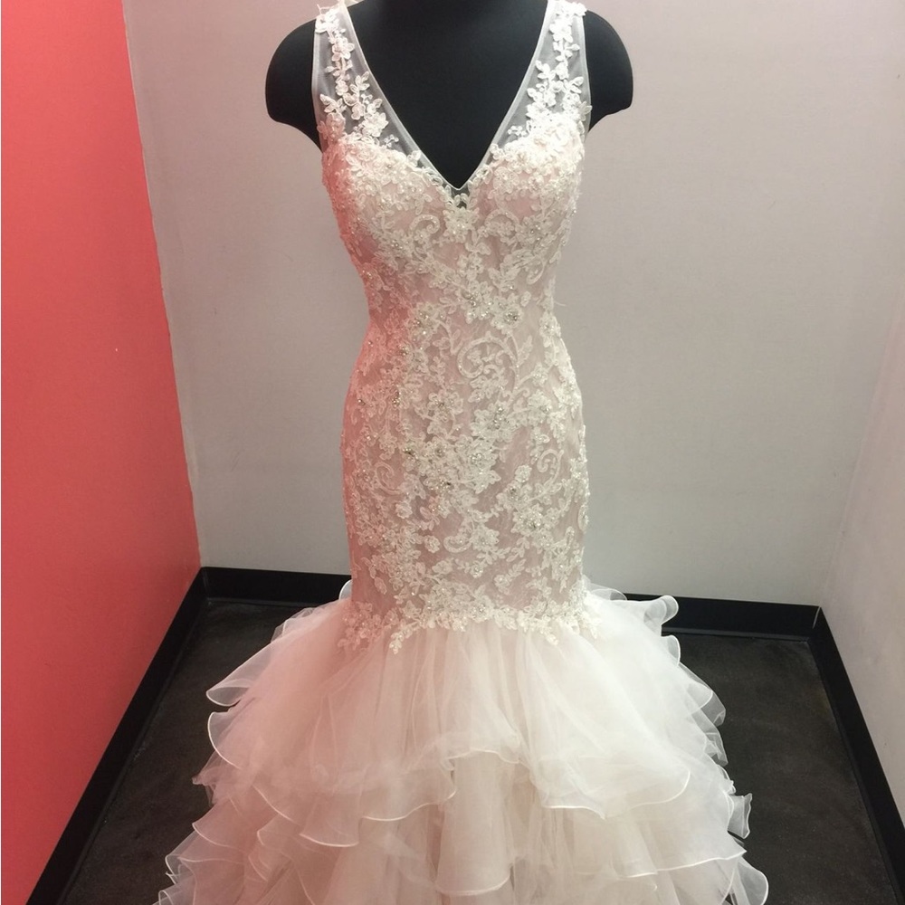 Brand new. Never worn, tried on, or altered. Mori Lee brand item #2819. Size 14.